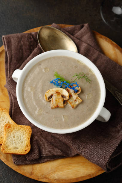 istock White mushrooms cream soup top view 1081960156