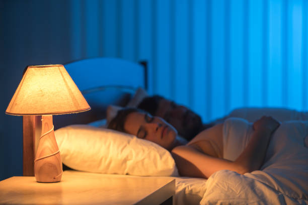 istock The sleeping couple on the bed. night time 1081960474
