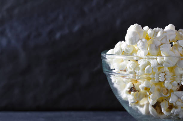 Popcorn closeup on a black textural background