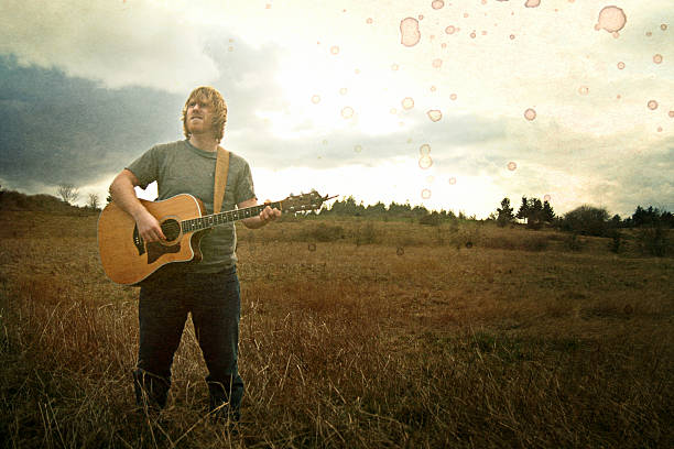 Vintage Young Guitarist in Field