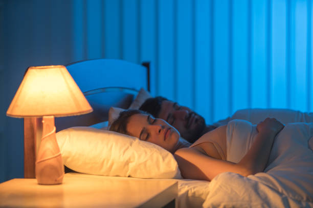 istock The sleeping couple on the bed. night time 1081960550