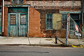 Facade of a grungy abandoned urban warehouse