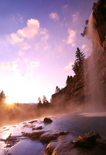 istock Beautiful Waterfall at Sunset and Hot Springs Pool 108196139