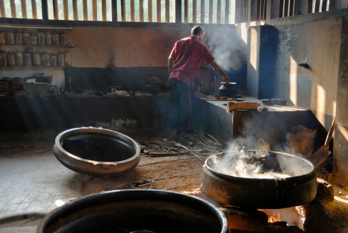 in an ayurvedic pharmacy: medicine and oils aree cooking traditionaly over open fire