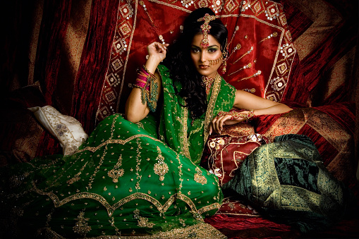 Indian woman laying in luxe ethnic interior.\n[url=http://www.istockphoto.com/my_lightbox_contents.php?lightboxID=2301216][img]http://iconogenic.com/STOCK/iconchaya.jpg[/img][/url]\n[url=http://www.istockphoto.com/my_lightbox_contents.php?lightboxID=5354477][img]http://iconogenic.com/STOCK/iconindian.jpg[/img][/url]