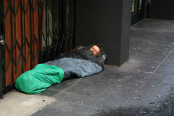 istock Homeless in sleeping-bag on the street 108196301