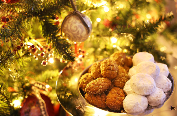 greek melomakarona and kourabies - traditional Christmas cookies with honey and nuts and sugar buns stock photo
