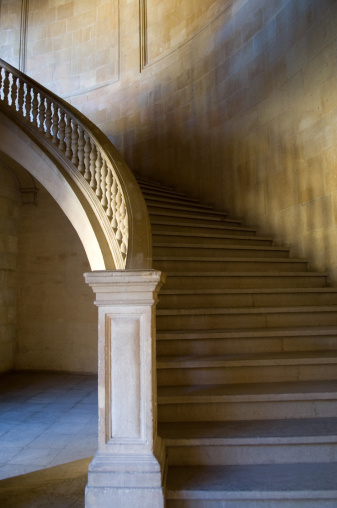 Wooden interior stairs staircase structure with brown colour, modern style and light window, up view