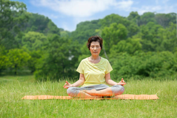 istock Senior women doing yoga 1081973278