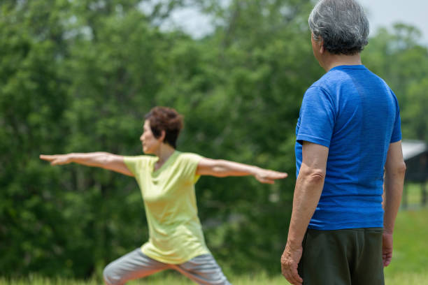 istock A senior couple doing yoga 1081973296