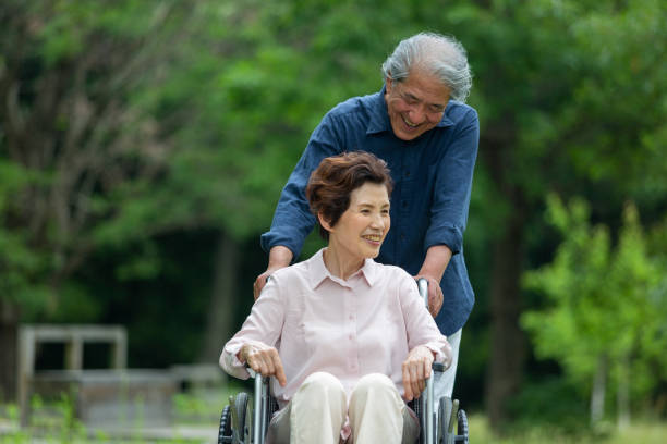istock An old couple walking in a wheelchair 1081973456