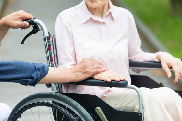 istock An old couple walking in a wheelchair 1081973496