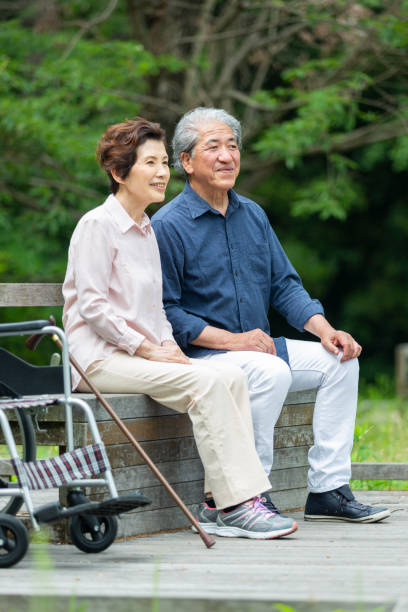 istock An old couple sitting on a bench 1081973618