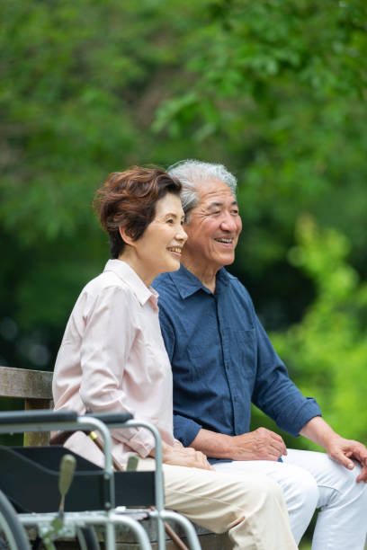 istock An old couple walking in a wheelchair 1081973636