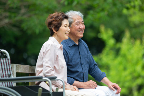istock An old couple sitting on a bench 1081973642