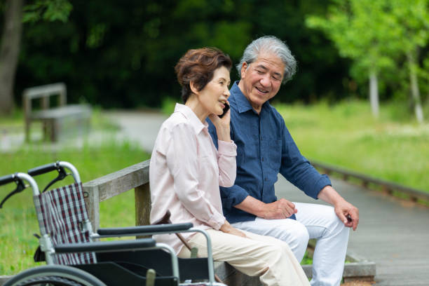 istock An old couple sitting on a bench 1081973712