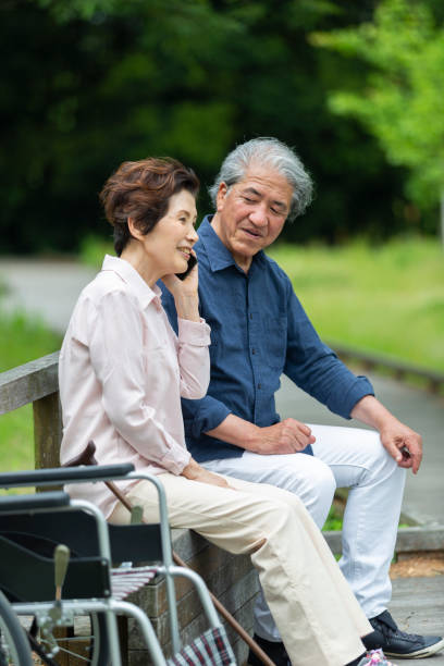 istock An old couple sitting on a bench 1081973722