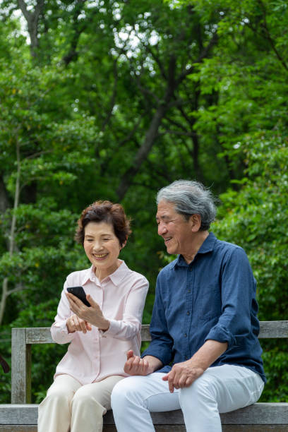 istock An old couple sitting on a bench 1081973788