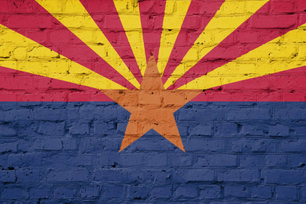 Texture of Arizona  flag  on a pink brick wall.