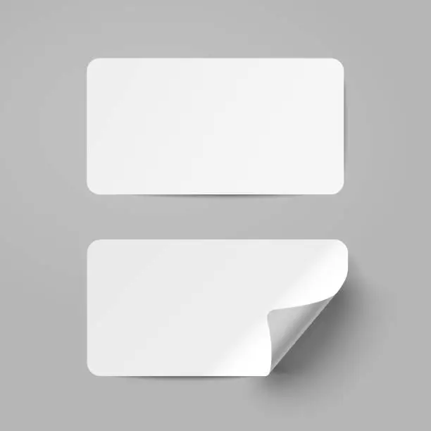 Vector illustration of Vector white realistic paper adhesive stickers with curved corneron transparent background.