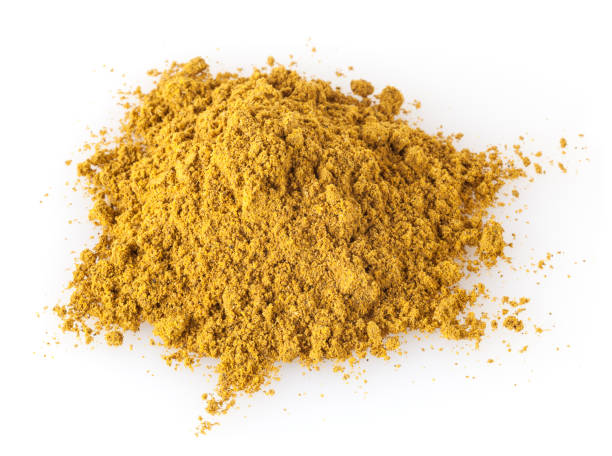 istock Pile of curry powder isolated on white background 1081976458