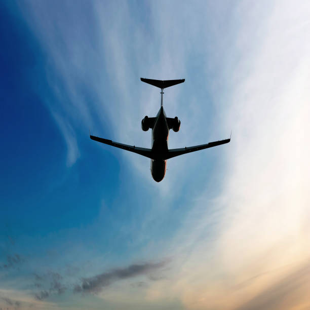 istock corporate jet airplane flying at dusk 108197781