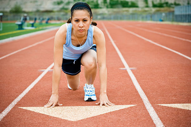 istock Female Runner on Track at Starting Line 108197800