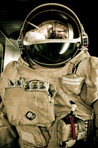 3D rendered cosmonaut in a white spacesuit on a black background. Asronaut on a black background levitating in an outer space. Astronaut in a space