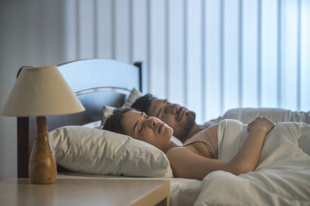 istock The attractive couple sleeping on the bed 1081979344