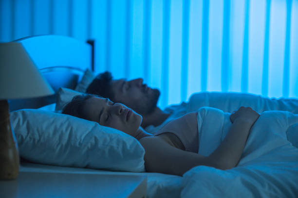istock The young couple sleeping on the bed. night time 1081979464