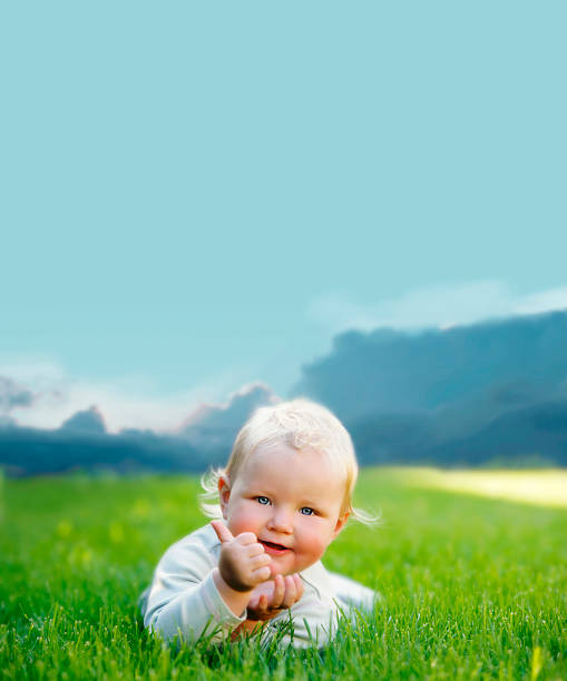 Cute baby laying on the grass