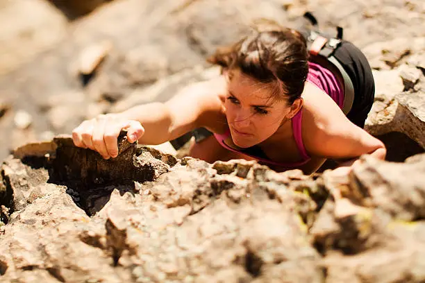 A female rock climber goes for the summit. Utah RedRockalypse 2.
