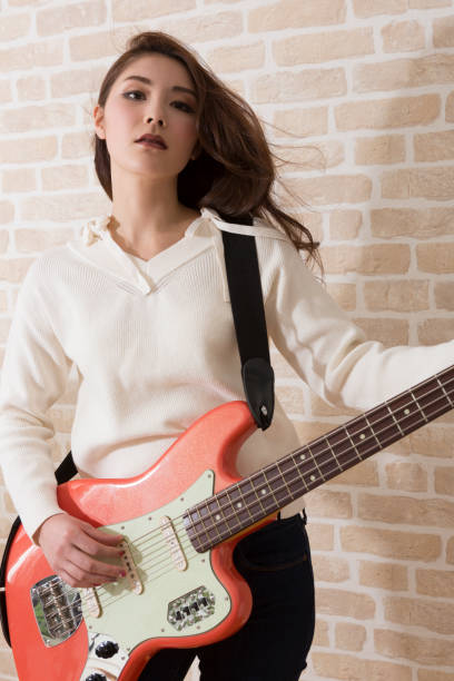 istock Woman playing bass 1081987726