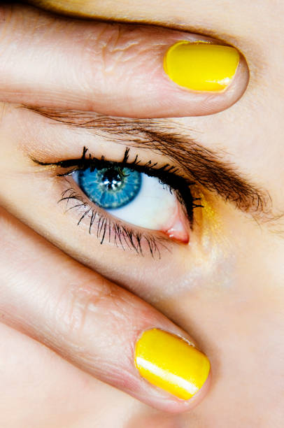 disco eye  yellow nail polish stock pictures, royalty-free photos & images