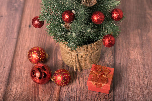 istock Christmas tree on wooden background 1081990974
