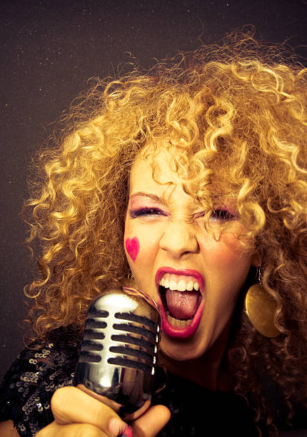 istock Young Woman Yelling in Microphone 108199233