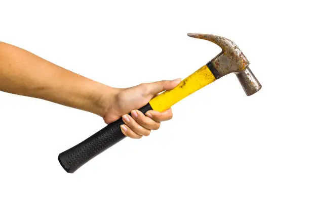 Photo of Cropped of a hand holding iron hammer isolated on white background include clipping path.