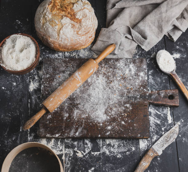 istock baked bread, white wheat flour, wooden rolling pin 1081993088
