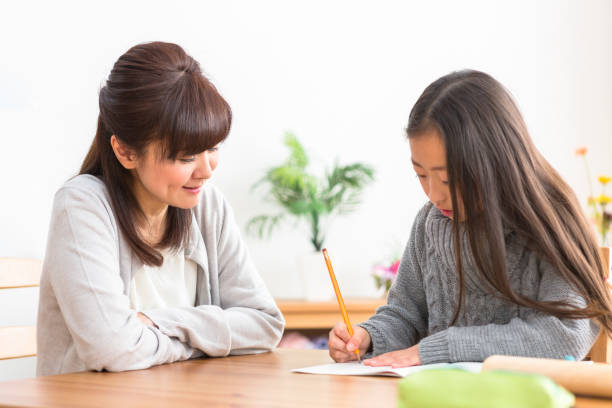 istock The child who studies and the parents who watch study 1081994532