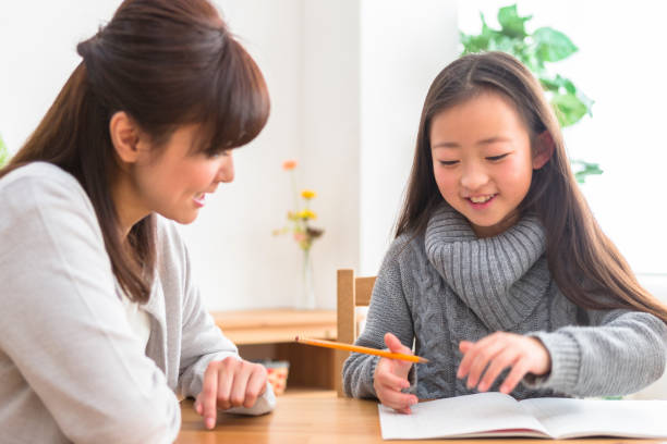 istock The child who studies and the parents who watch study 1081994544
