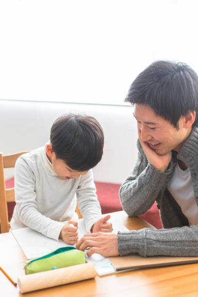 istock The child who studies and the parents who watch study 1081994562
