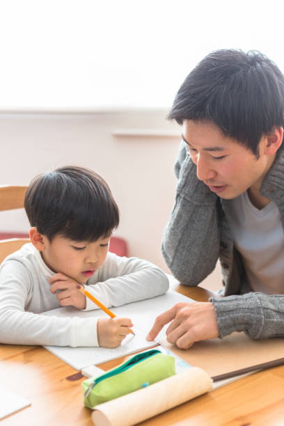 istock The child who studies and the parents who watch study 1081994602