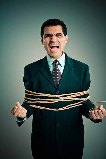 istock Angry Businessman Tied up with Rope 108199595