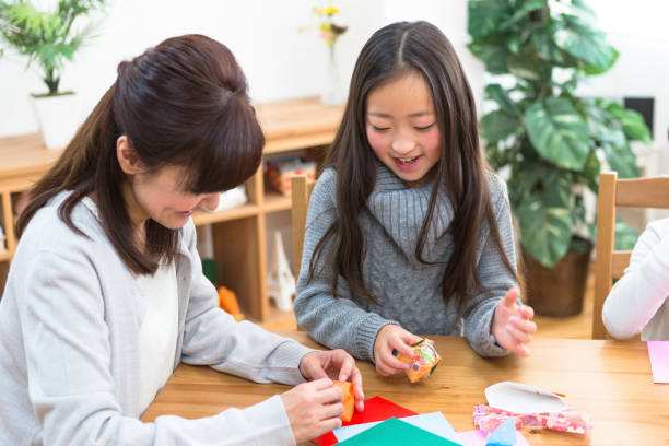 istock Folding Origami Parent and child 1081996002