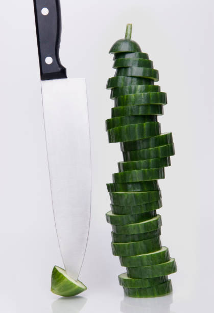 Sliced Cucumber & knife stock photo