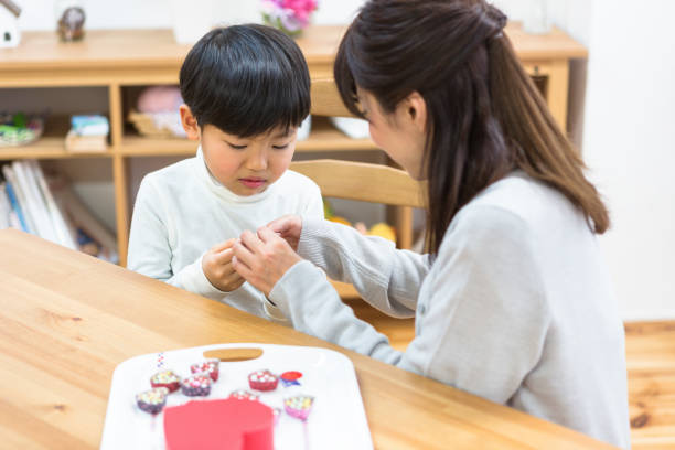 istock Mother giving chocolate to her son 1081996660