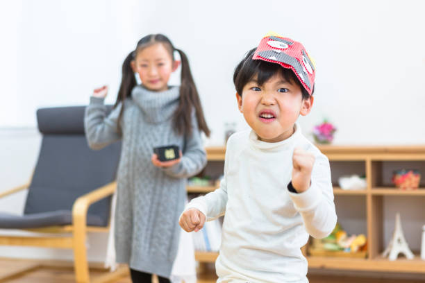 istock Sister and brother doing the bean-throwing of Setsubun 1081996748