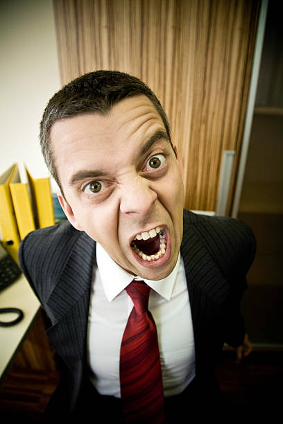 istock Enraged Businessman Screaming and Yelling in Office 108199901