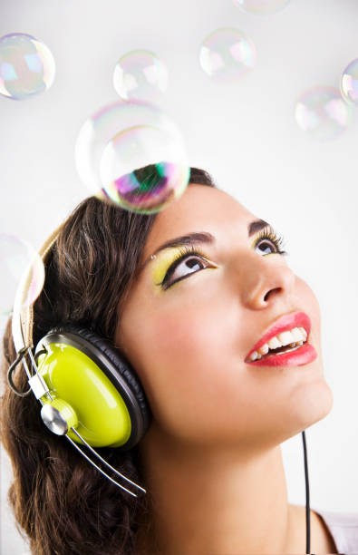 istock Young Woman Wearing Headphone with Bubbles All Around 108199996