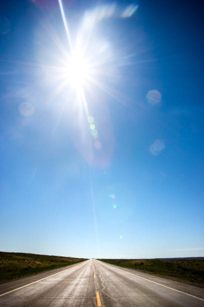 Bright sun with beautiful beams in the blue sky. Space for copy.